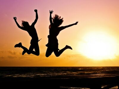 silhouette photography of jump shot of two persons